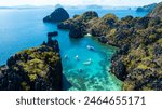  Aerial view of One of the best island and beach destination in the world, a stunning view of rocks formation and clear water of El Nido Palawan, Philippines.