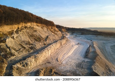 Aerial view of open pit mine of sandstone materials for construction industry with excavators and dump trucks. Heavy equipment in mining and production of useful minerals concept - Shutterstock ID 2088906367