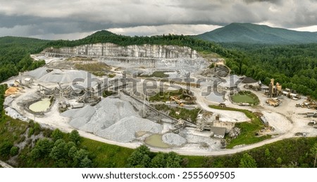Aerial view of open pit mining site of limestone materials extraction for construction industry