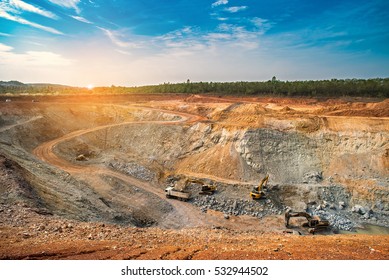Aerial view of opencast mining quarry with lots of machinery at work - view from above.This area has been mined for copper, silver, gold, and other minerals,Thailand - Shutterstock ID 532944502