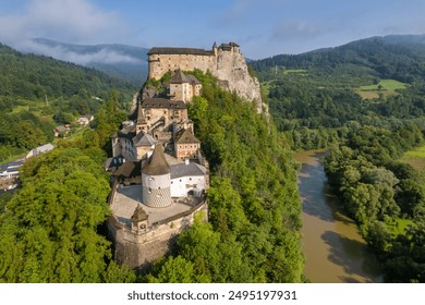 Aerial view of the Orava castle at sunrise, Slovakia. Medieval Oravsky Hrad castle on high and steep cliffs by the Orava River - Powered by Shutterstock