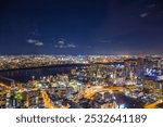 Aerial view of the Osaka cityscape at night from the observation platform at the Umeda sky building.