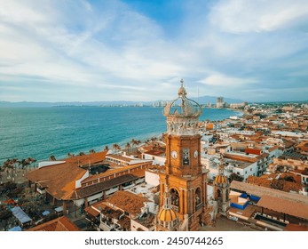 Aerial view of our Lady of Guadalupe church in Puerto Vallarta, Mexico and ocean at golden hour. - Powered by Shutterstock