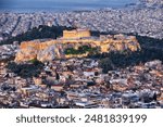 Aerial view over Athens with te Acropolis and harbour from Lycabettus hill, Greece at sunrise