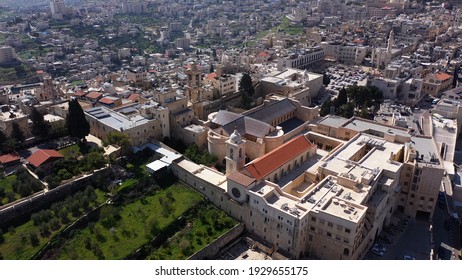 Aerial view over Church of the Nativity And City Square Of Bethlehem
, Morning shot from Bethlehem, the town where Jesus was born. Place of The Church of the Nativity - Shutterstock ID 1929655175