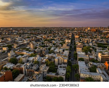 An aerial view over Greenpoint Brooklyn in New York in an industrial and now also residential area during a very colorful sunrise. - Powered by Shutterstock