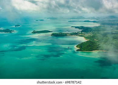 Aerial view over group of island in Andaman sea near Phuket, southern part of Thailand, Top view from airplane, Travel in Thailand