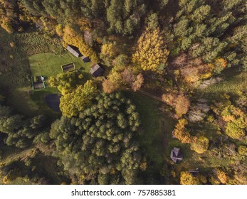 Aerial view over Liskiava village on the bank of river Nemunas, Lithuania. During an Autumn season, surrounded by yellow trees.