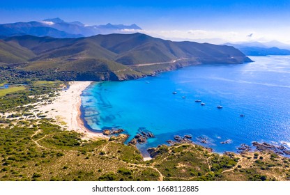 Aerial View over Ostriconi beach on North east coast of Corsica Island near Ile Rousse, Calvi, France - Powered by Shutterstock