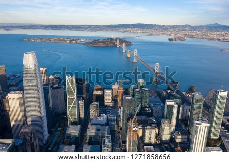 Aerial view over San Francisco's SOMA neighborhood looking towards the bay and Bay Bridge