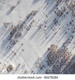 Aerial view over snowy field