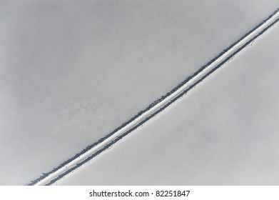 Aerial View Over Snowy Field And Road