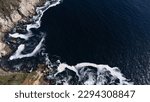 aerial view of the pacific ocean coast with waves