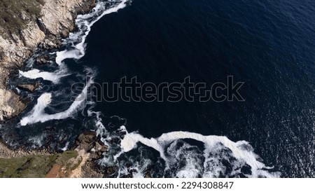 aerial view of the pacific ocean coast with waves