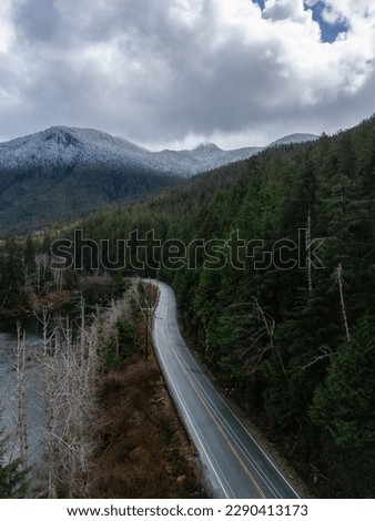 Aerial View of Pacific Rim Hwy in Canadian Mountain Landscape. Highway to Tofino, Vancouver Island, British Columbia, Canada. Adventure Travel