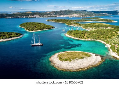 Aerial view of Paklinski Islands in Hvar, Croatia. Turquise water bays with luxury yachts and sailing boats. Toned image. - Shutterstock ID 1810555702