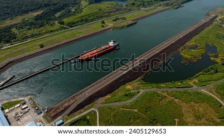 Aerial view Panama Canal, third set of locks, water shortages, maritime traffic, water reuse vats, summer drought.