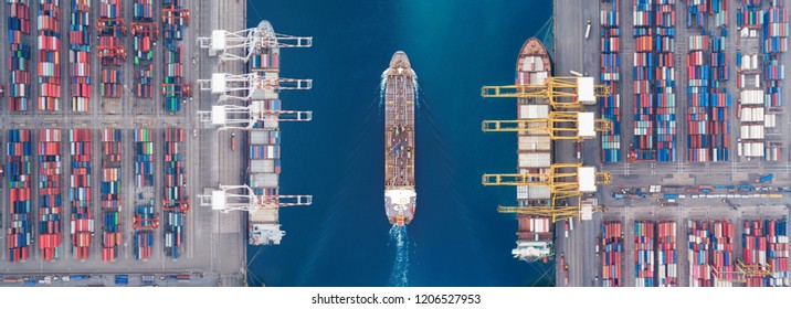 Aerial view panoramic oil tanker moving pass sea port warehouse and container ship or crane ship working for delivery containers shipment. 