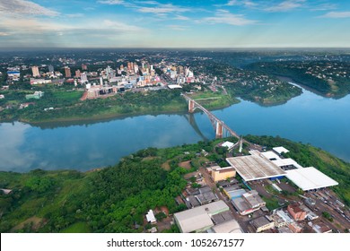 Aerial view of the Paraguayan city of Ciudad del Este and Friendship Bridge, connecting Paraguay and Brazil through the border over the Parana River.