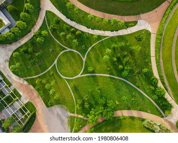 Aerial view of Parco del Portello in Milan, near CityLife, Lombardia. View from the height of park with a green lawn and paths. Abstract design similar to a dragon. Drone photography in Milano. - Powered by Shutterstock