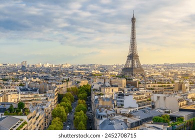 Aerial view of Paris with Eiffel Tower and Champs Elysees from the roof of the Triumphal Arch. Panoramic sunset view of old town of Paris. City skyline. Popular travel destination - Powered by Shutterstock