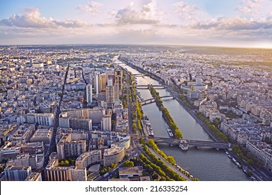 Aerial View Of Paris And Seine River From Eiffel Tower At Sunset.