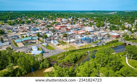 Aerial view of park area leading to wide view of Mount Vernon city in Ohio