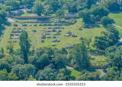 Aerial view of a park area with remains of ancient ruins in a green landscape in Budapest, Hungary - Powered by Shutterstock