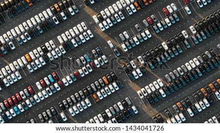 Aerial view of the parked new cars at the automotive plant
