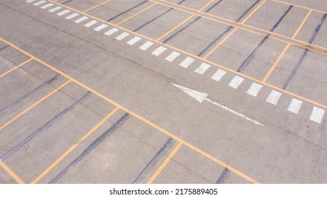 Aerial View Of A Parking Lot Of A Large Italian Shopping Center. There Are No People Or Cars Parked.