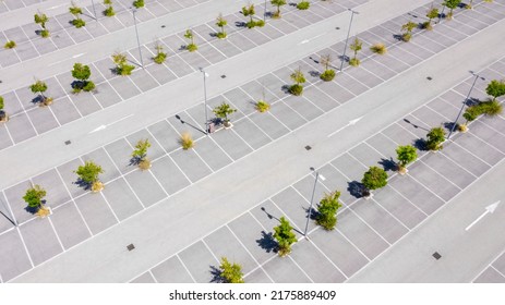 Aerial View Of A Parking Lot Of A Large Italian Shopping Center. There Are No People Or Cars Parked.