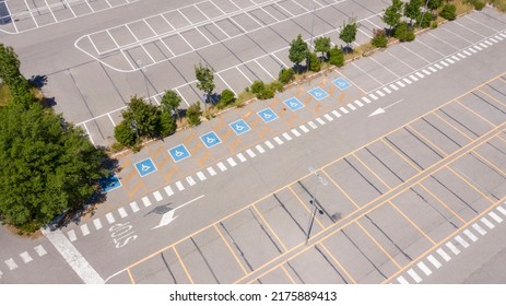 Aerial View Of A Parking Lot Of A Large Italian Shopping Center. There Are No People Or Cars Parked.