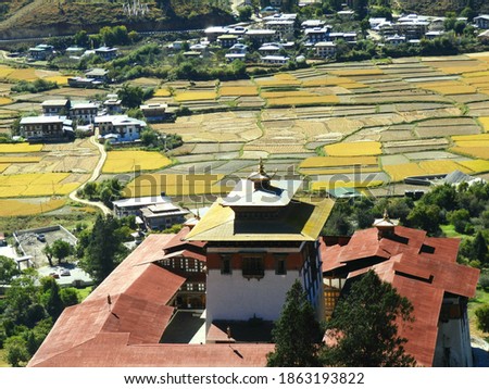 Aerial view of Paro Ringpung Fortress with beautiful Paro Valley at backdrop