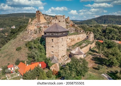 Aerial view of partially restored medieval Filakovo Fulek castle in Southern Slovakia with cannon bastion summer view with blue cloudy sky historic monument from the Turkish Hungarian wars - Powered by Shutterstock