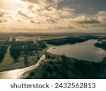 Aerial view of parts of the famous Sherwood Forest seen from the sky in rural Nottinghamshire, UK. The large Thoresby Lake can be seen and dam.