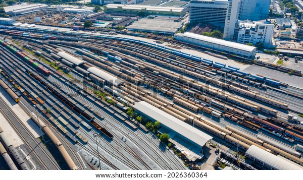 Aerial view of Passenger and\
railway wagons. Cargo trains. Train container cargo on the railway\
station for transportation background. wagons with goods on\
railroad.