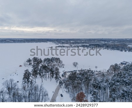 Aerial view of Pazaislis monastery in Kaunas, Lithuania in winter with an icy Kaunas lagoon in background