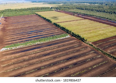 Aerial View Of Peat Harvesting Field. Peat Extraction