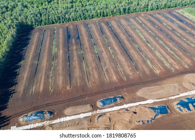 Aerial View Of Peat Harvesting Field. Peat Extraction