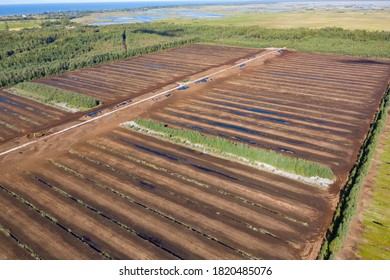 Aerial View Of Peat Harvesting Field. Peat Extraction