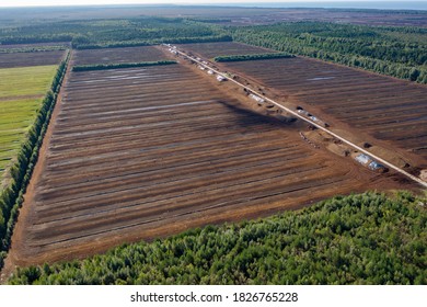 Aerial View Of Peat Harvesting Field. Peat Extraction