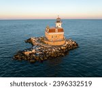 Aerial view of Penfield Reef Lighthouse on Long Island Sound at sunset Fairfield, CT