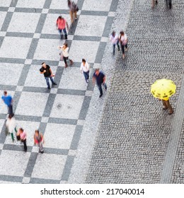 Aerial View Of People In Motion Blur Walking On A City Square