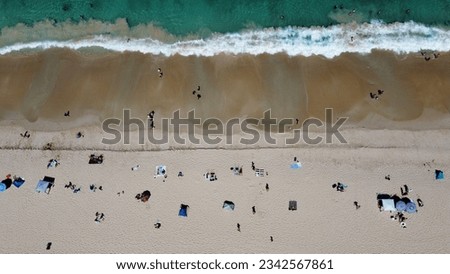 Similar – Aerial View From Flying Drone Of People Crowd Relaxing On Algarve Beach In Portugal