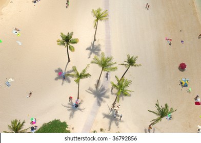 An Aerial View Of People Relaxing On A Resort Beach