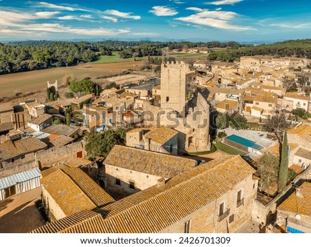 Aerial view of Peratallada, historic artistic small fortified medieval town in Catalonia, Spain near the Costa Brava. Stone buildings rutted stone streets and passageways.Robin hood filming location