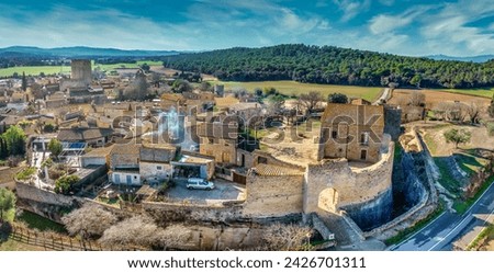 Aerial view of Peratallada, historic artistic small fortified medieval town in Catalonia, Spain near the Costa Brava. Stone buildings rutted stone streets and passageways.Robin hood filming location