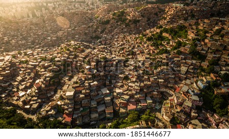 Aerial view of Petare Slum, in Caracas, Venezuela, during a sunset 