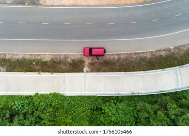 Aerial View Photo High Angle View Top Down Of Red Suv Car On Road