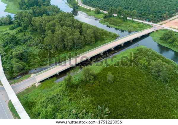 Aerial view photo high angle view top down of bridge\
in the lake